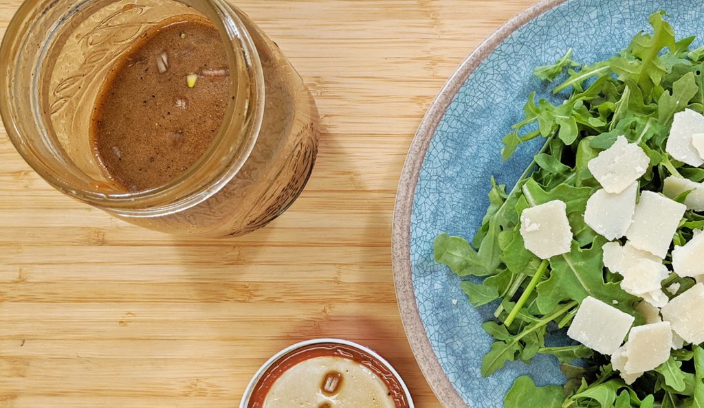 Salad on a Plate with Salad Dressing in a Jar
