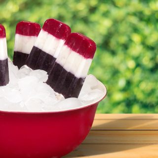 red, white and blue Popsicles in a red bowl