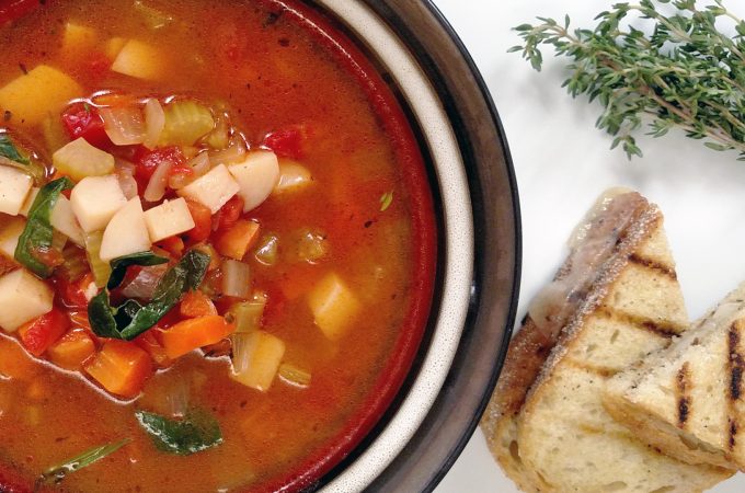 Mom's Vegetable Soup in a bowl, grilled bread, thyme