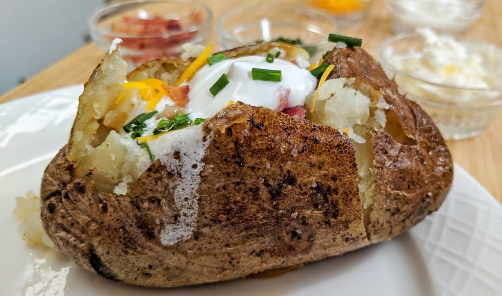 Loaded Baked Potato on a white plate
