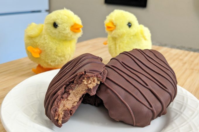 Keto Reese's Peanut Butter Cups on a white plate in egg shape with chicks